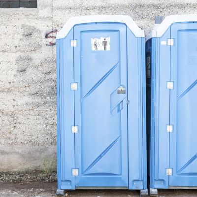 Two blue portable toilet.